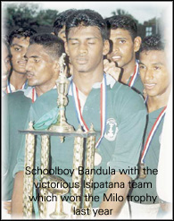 Bandula with the Isipatana team which won the Milo trophy.