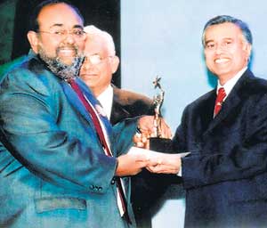 Sathis Abeywickrema receiving the award.
