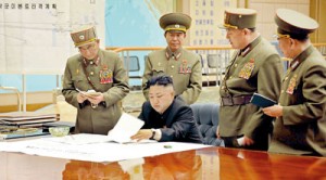 North Korean leader Kim Jong-un (C) presides over an urgent operation meeting on the Korean People's Army Strategic Rocket Force's performance of duty for firepower strike at the Supreme Command in Pyongyang (REUTERS)