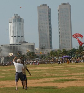 A tourist being taught to fly a kite by a Sri Lankan at the Galle Face Green, Colombo. Tourism is growing by leaps and bounds in post-war Sri Lanka. Pic by Nilan Maligaspe