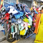 Gas Paha Junction: Slippers galore: Shoppers take in what's on offer. Pic by Nilan Maligaspe