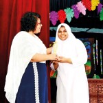 Saaliha Faahik receiving the Al Awwal Best all-rounder  2022 award from chief guest Ms. Ifthiya Cader