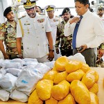 Navy commander inspects the haul of drugs. Pix by M.A. Pushpa Kumara