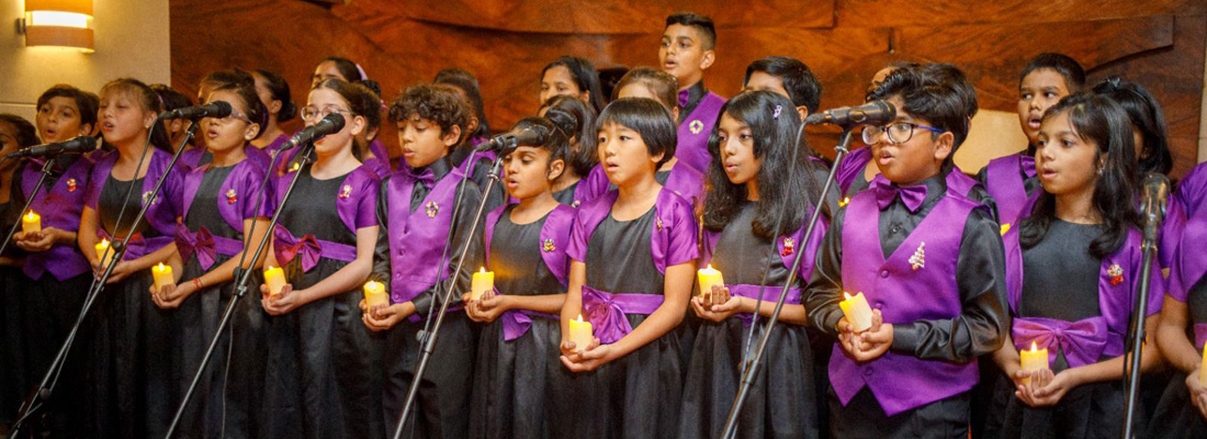 The British School Choir set the stage at the lighting of the Christmas tree at Cinnamon Lakeside