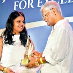 Upali Wijewardene Feature Writer of the Year: Tharushi Weerasinghe of The Sunday Times receiving her award from Nimal Welgama, Chairman of Upali Newspapers Pvt. Ltd)