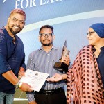 Best Designed Newspaper of the Year: Asitha Rathnayake and Anusha de Silva from the Sunday Times design team receiving the award from Hana Ibrahim, Convener of the Free Media Movement