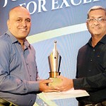 Photojournalist of the Year: Pradeep  Pathirana of the Daily Mirror receiving his award from Duminda Balasuriya, Editor-in-Chief of Ada