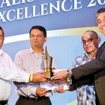 Best Designed News Website: Ft.lk team receives their award from Kanishka Sugathadasa - Member of the Panel of Judges (Online Newspapers) and Harsha Samaranayake, Vice President of Brands and Media, Dialog Axiata PLC