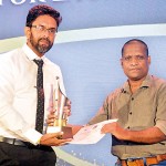 Cartoonist of the Year Award:  Awantha Artigala receiving his award from Duminda Sampath, President of Sri Lanka Working Journalists Association.  Awantha won both the English and Sinhala categories.