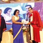 Dr. Surantha Perera hands over a copy of the ‘SLMA 2025 Road Map’ to health official  Dr. Lakshmi Somatunge, while SLMA’s Immediate Past President Dr. Ananda Wijewickrama looks on